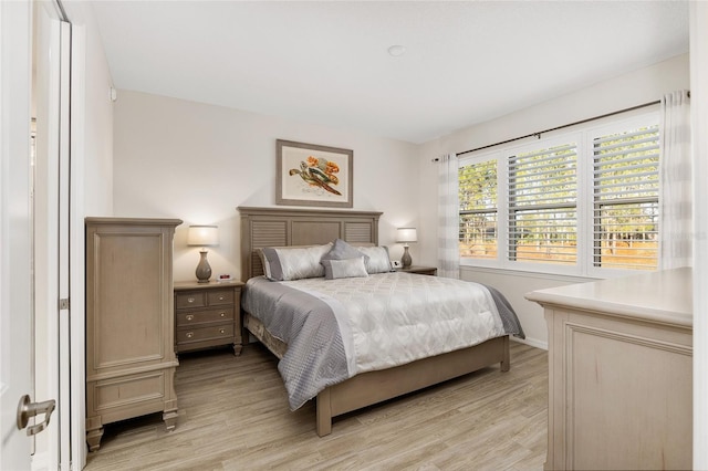 bedroom with light wood-type flooring