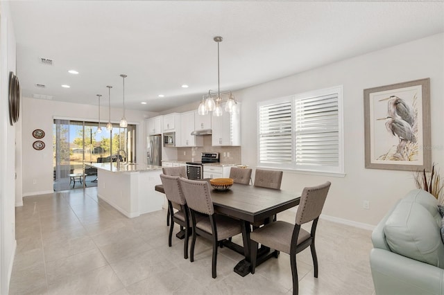 tiled dining area with sink