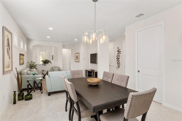 dining space featuring light tile patterned flooring