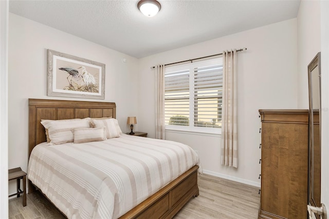 bedroom featuring light wood-type flooring