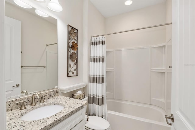 full bathroom featuring toilet, shower / bath combination with curtain, and vanity