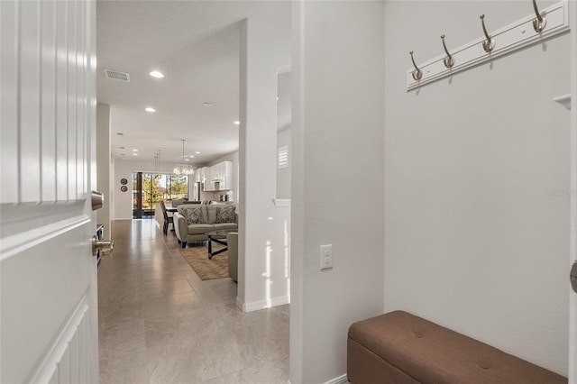 hallway featuring light tile patterned floors