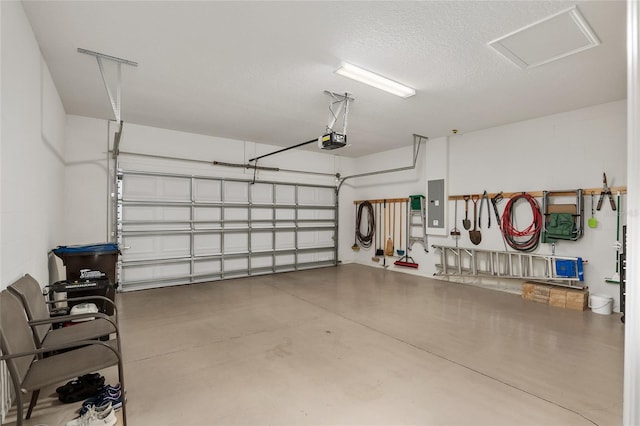 garage featuring electric panel and a garage door opener