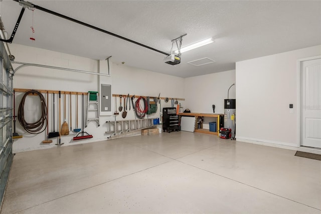 garage featuring electric panel, hybrid water heater, and a garage door opener