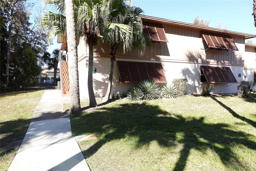 view of home's exterior with a yard