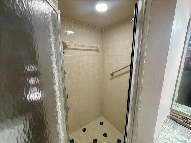 bathroom featuring an enclosed shower