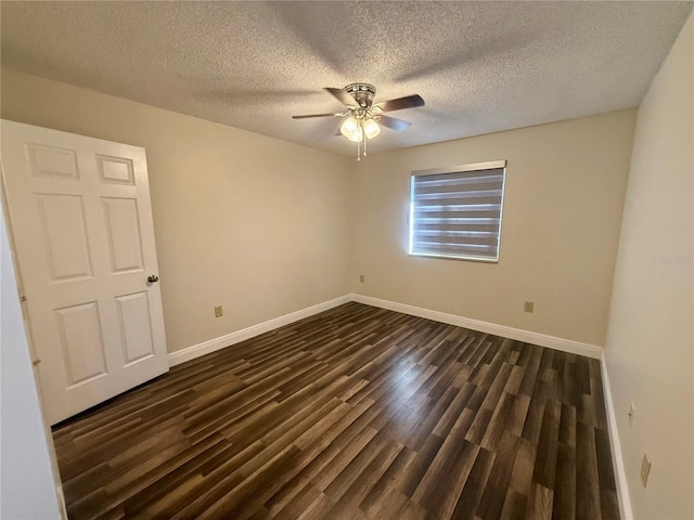 spare room featuring ceiling fan, a textured ceiling, and dark hardwood / wood-style floors