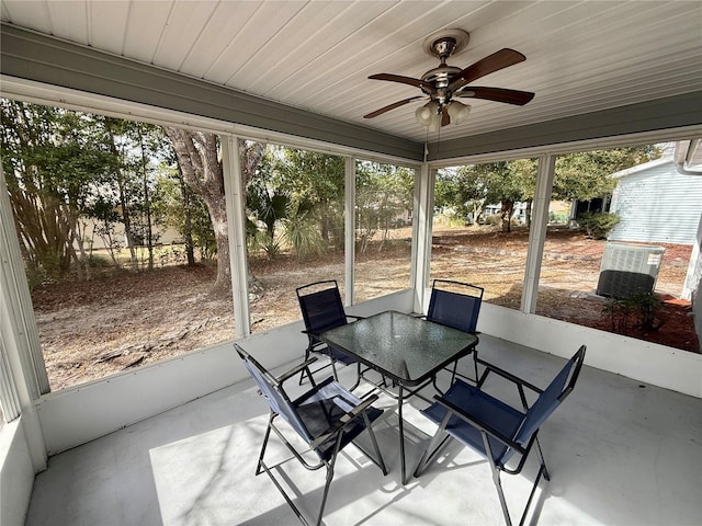 unfurnished sunroom featuring ceiling fan