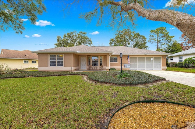 ranch-style house featuring a garage, a front yard, and a porch