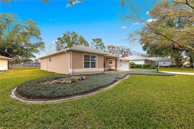 single story home featuring a front lawn and a garage