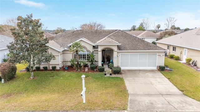 ranch-style home featuring a front lawn and a garage