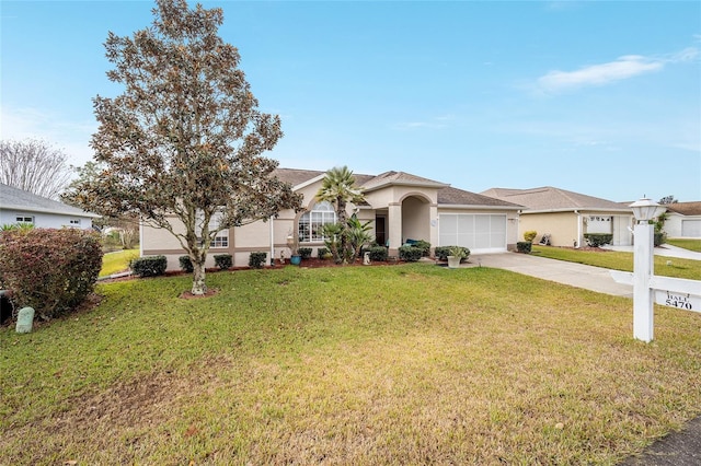 single story home featuring a front lawn and a garage