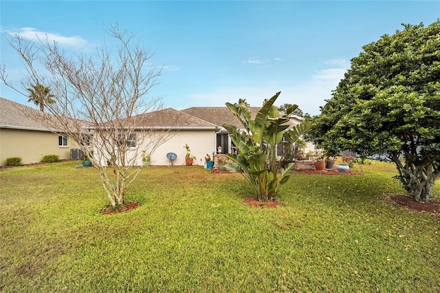 view of yard featuring central AC