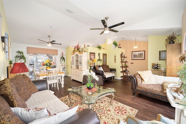 living room featuring vaulted ceiling, ceiling fan, and dark hardwood / wood-style floors