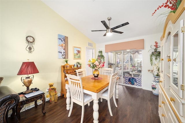 dining space featuring ceiling fan, dark hardwood / wood-style floors, and lofted ceiling