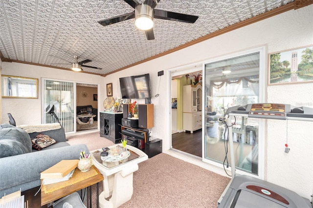 living room featuring ornamental molding and carpet flooring