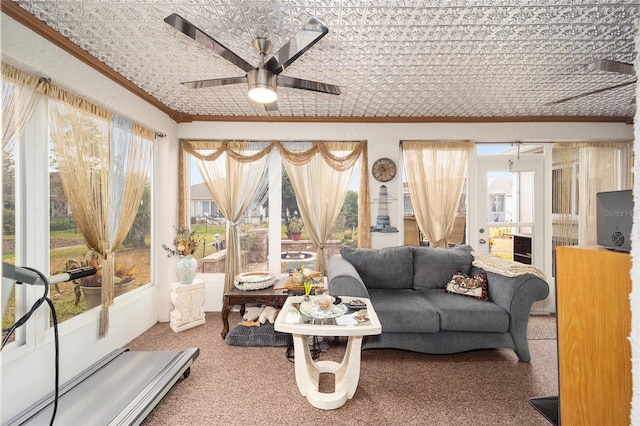 interior space featuring ceiling fan, a wealth of natural light, and carpet