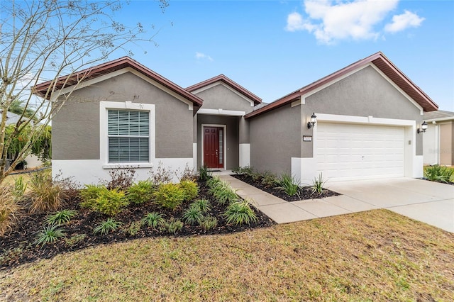 view of front of property with a front lawn and a garage