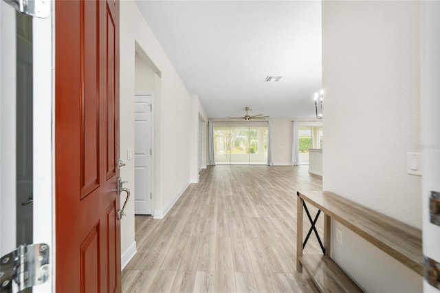 corridor featuring light hardwood / wood-style flooring