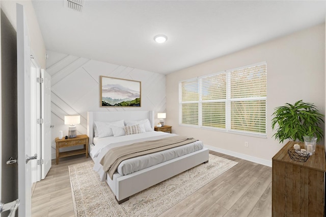 bedroom with light hardwood / wood-style floors