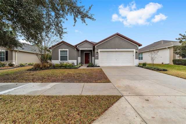 ranch-style home featuring a front yard and a garage