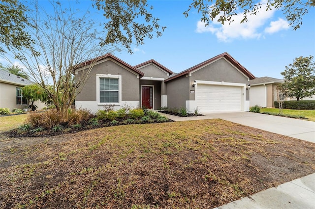 ranch-style house with a front lawn and a garage