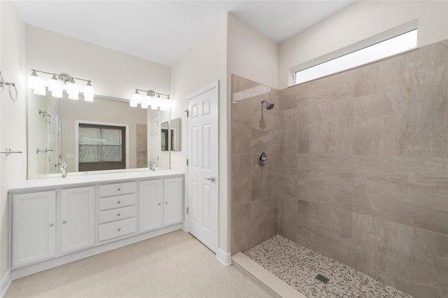 bathroom featuring vanity and a tile shower