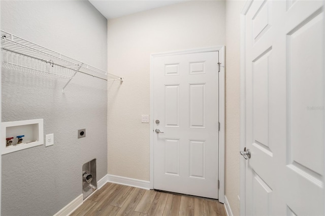 laundry area with hookup for a washing machine, hookup for an electric dryer, and light wood-type flooring