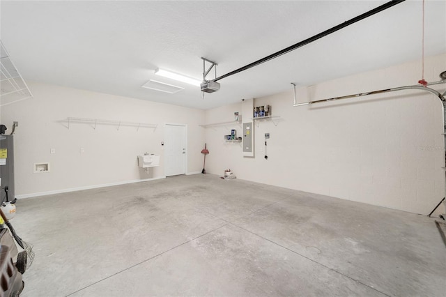 garage featuring water heater, sink, a garage door opener, and electric panel