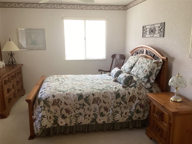 bedroom featuring light carpet