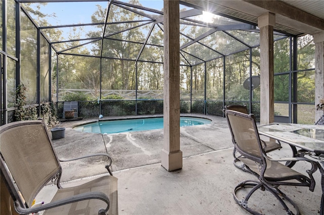 view of pool featuring a lanai and a patio