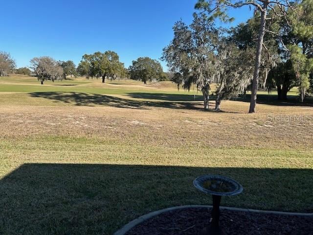 view of home's community featuring a lawn