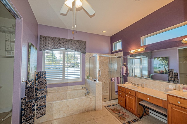 bathroom with shower with separate bathtub, tile patterned floors, ceiling fan, and vanity