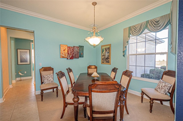 dining space with ornamental molding and light tile patterned floors