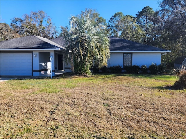 view of front of house featuring a garage and a front yard