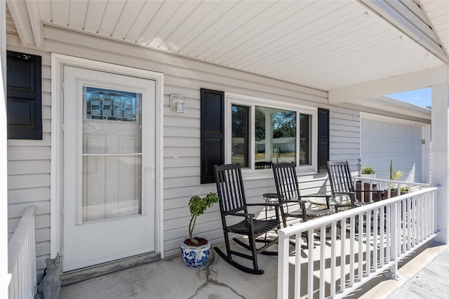 exterior space featuring a garage and a porch