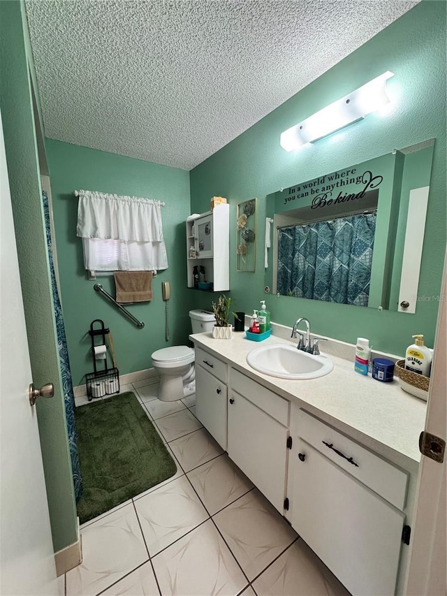 bathroom featuring a textured ceiling, toilet, vanity, and tile patterned flooring