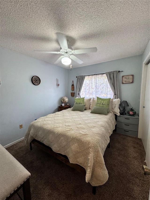 bedroom featuring ceiling fan, carpet, and a textured ceiling