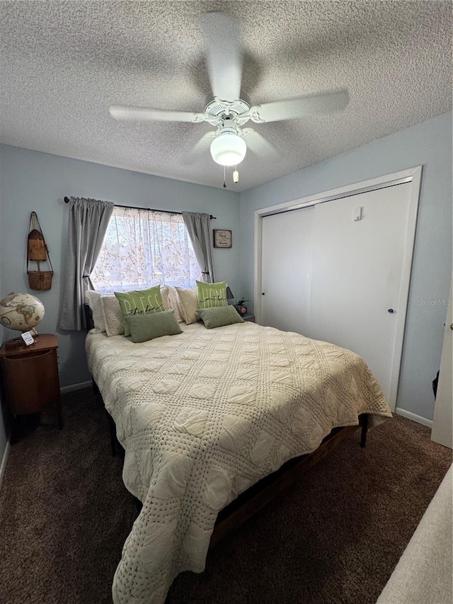 carpeted bedroom featuring a textured ceiling, ceiling fan, and a closet