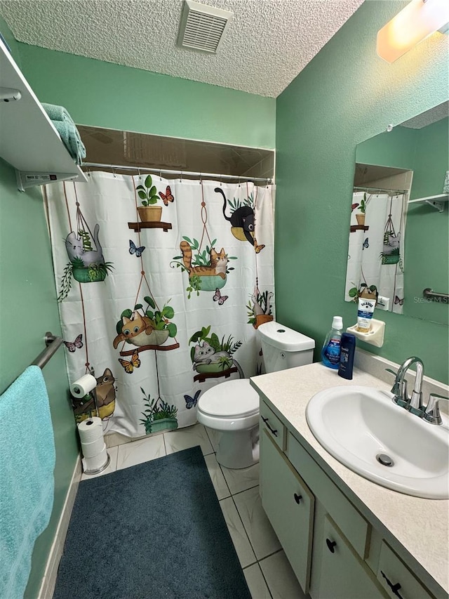 bathroom with toilet, vanity, walk in shower, tile patterned floors, and a textured ceiling