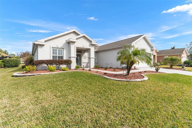 view of front of house featuring a front yard and a garage