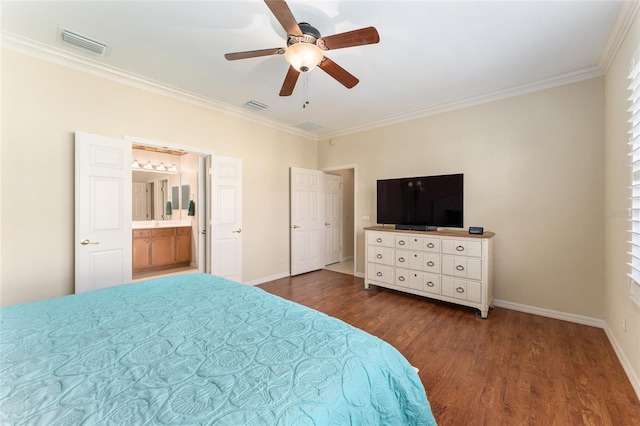 bedroom with ceiling fan, dark hardwood / wood-style flooring, crown molding, and ensuite bathroom