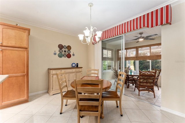 dining room featuring light tile patterned flooring, ornamental molding, and ceiling fan with notable chandelier