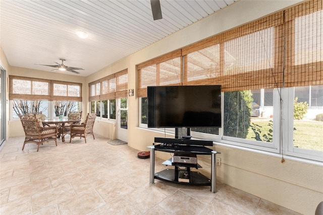 sunroom with ceiling fan and a wealth of natural light