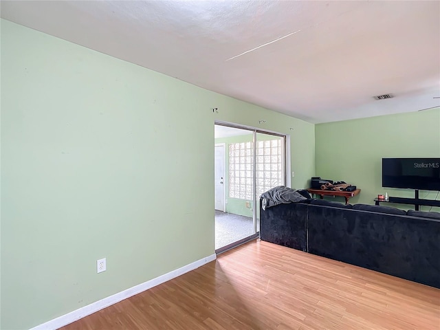 living room with light hardwood / wood-style floors