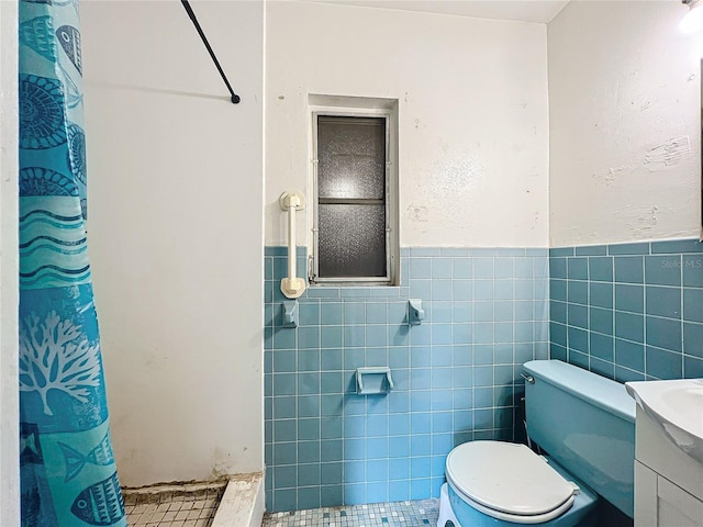 bathroom with toilet, tile walls, a shower with curtain, and vanity