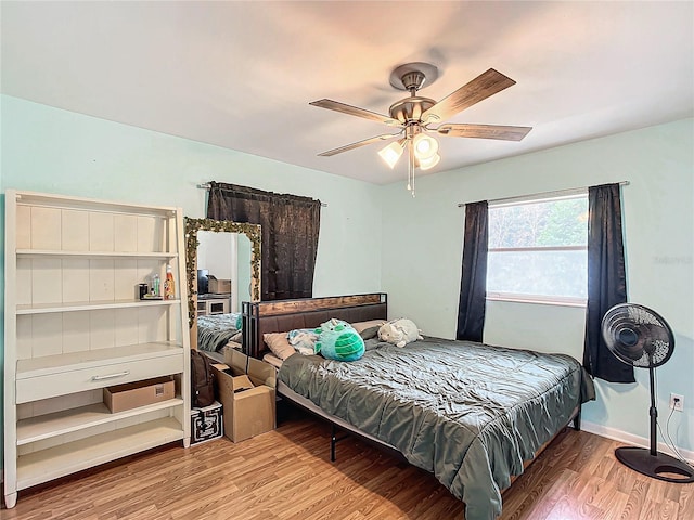 bedroom featuring ceiling fan and hardwood / wood-style floors