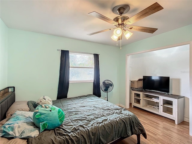 bedroom with ceiling fan and light hardwood / wood-style flooring