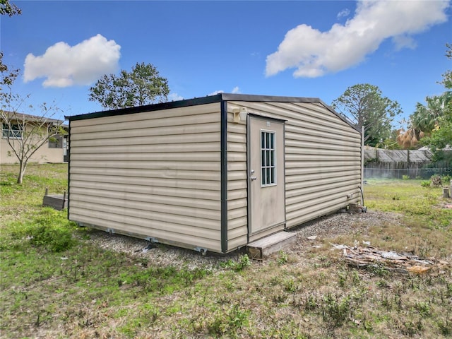 view of outbuilding featuring a yard