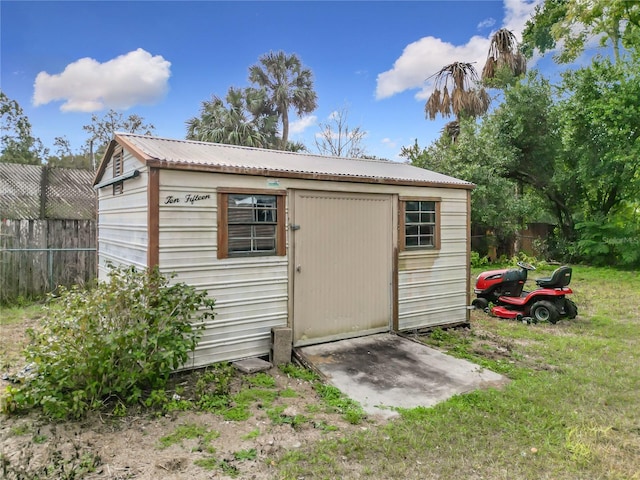 view of outbuilding featuring a yard